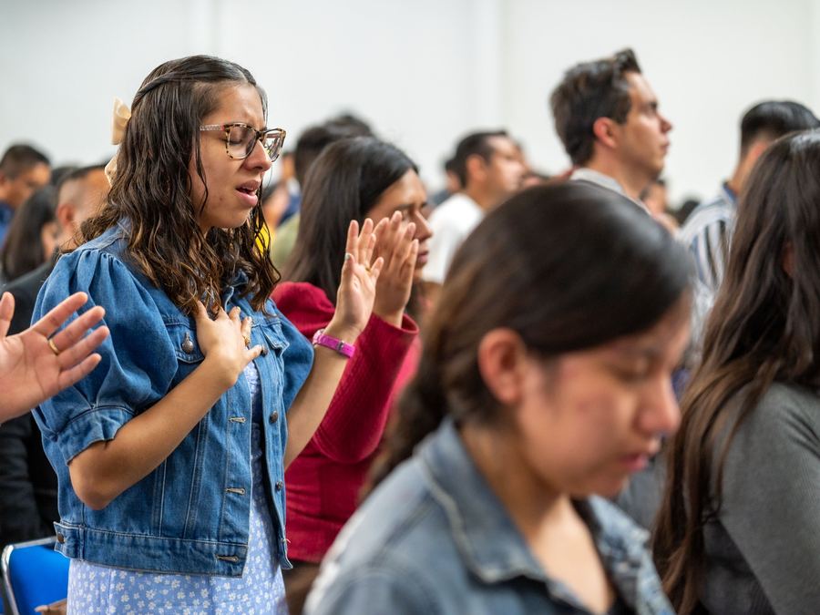 A new believer worshipping during a service