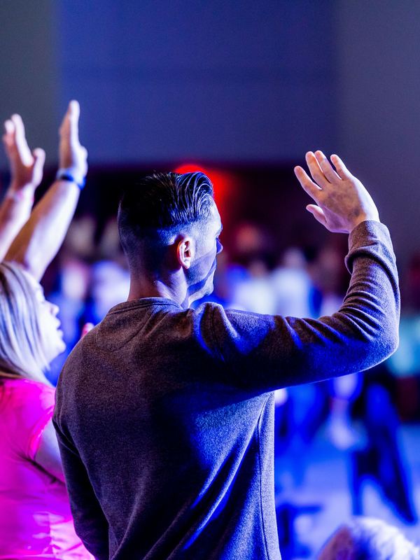Worshippers raising their hands during a Sunday service